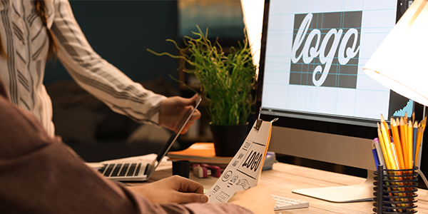 Blog Featured Image - Designers working on a logo